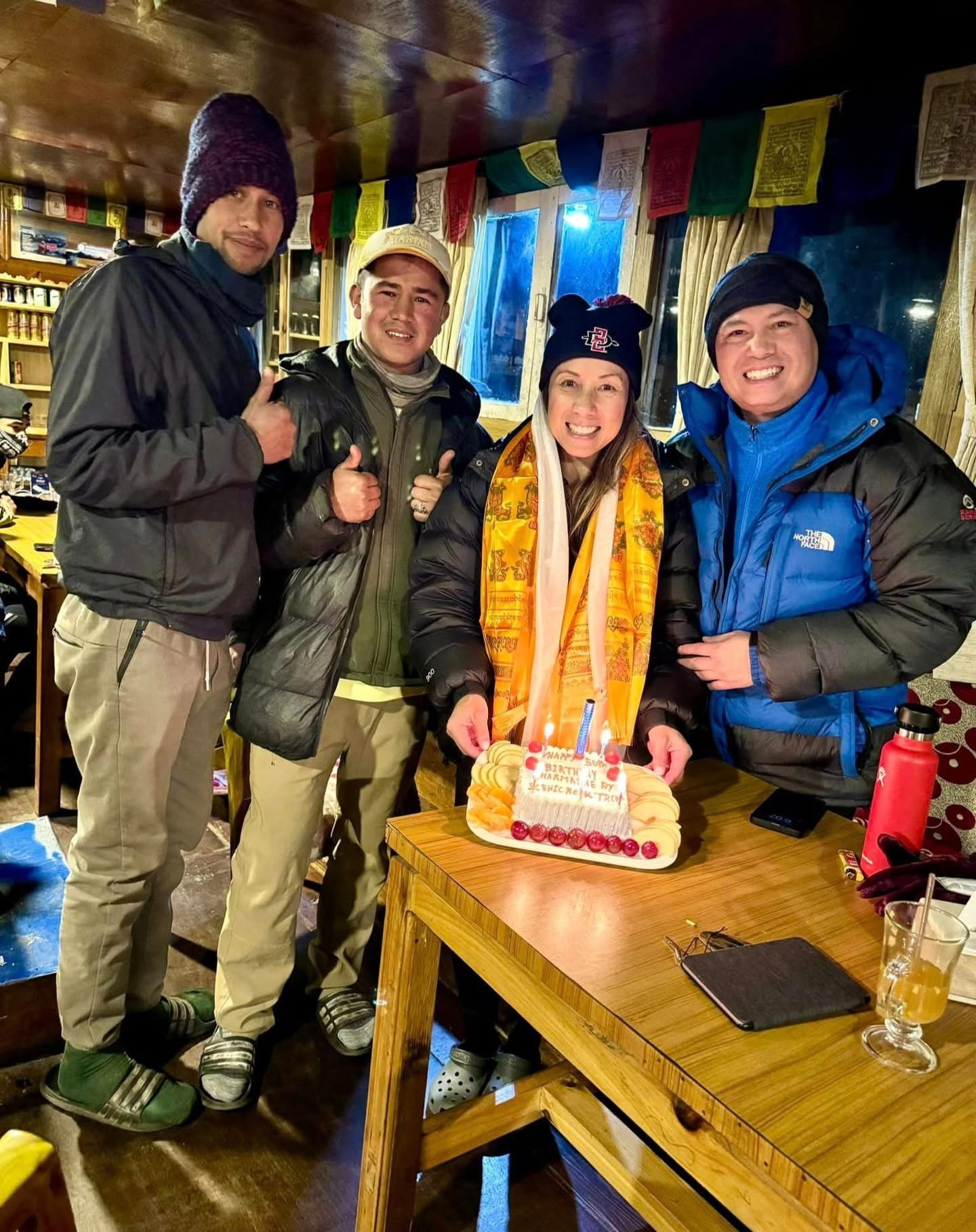 Traveler celebrating birthday at Everest Base Camp during Nepal trekking adventure